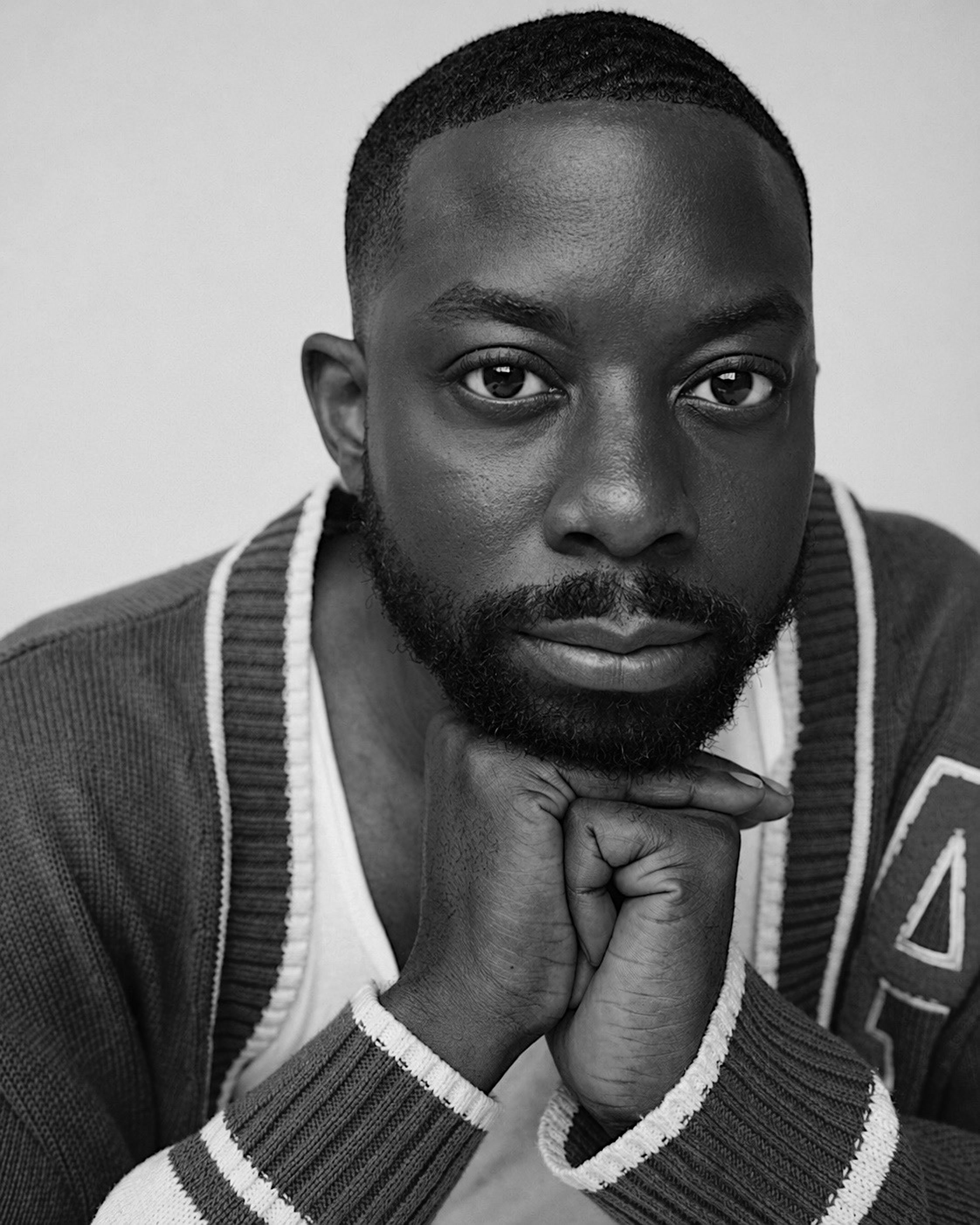 John Imah in a black-and-white portrait